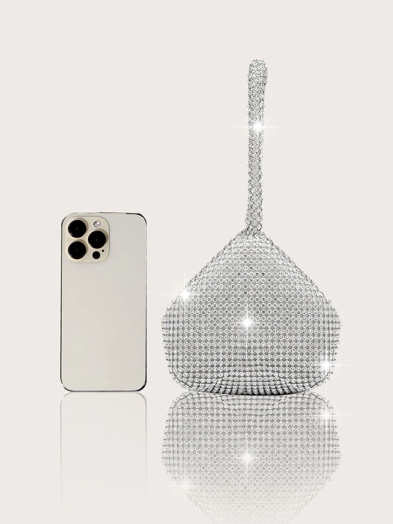Elegant and luxurious rhinestone-encrusted evening bag and clutch, paired with a four-piece necklace, earrings and bracelet.-belleandkai.com