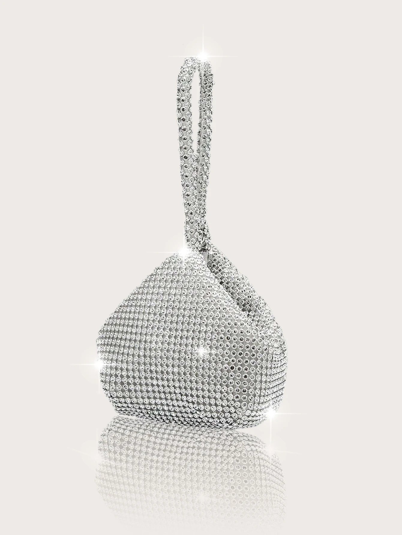 Elegant and luxurious rhinestone-encrusted evening bag and clutch, paired with a four-piece necklace, earrings and bracelet.-belleandkai.com